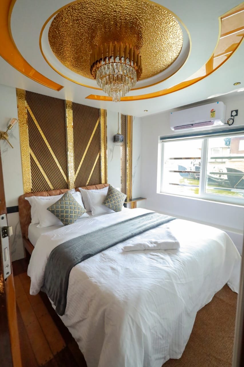 Master AC suite featuring a beautiful golden ceiling design.