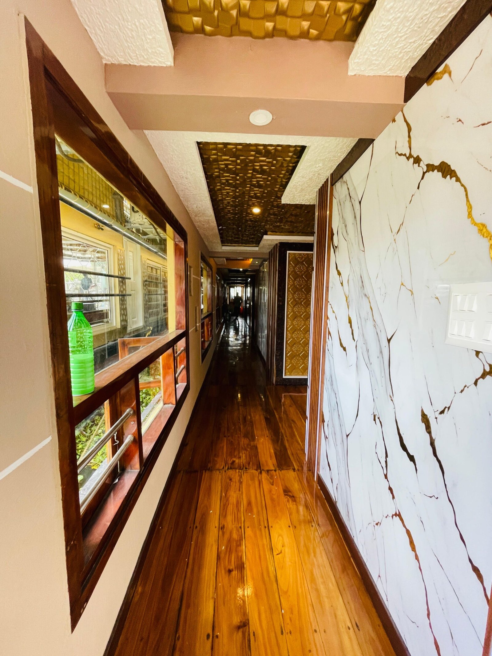Premium Interior Corridor Long polished wooden corridor connecting the guest suites on our 8 bedroom houseboat in Alleppey