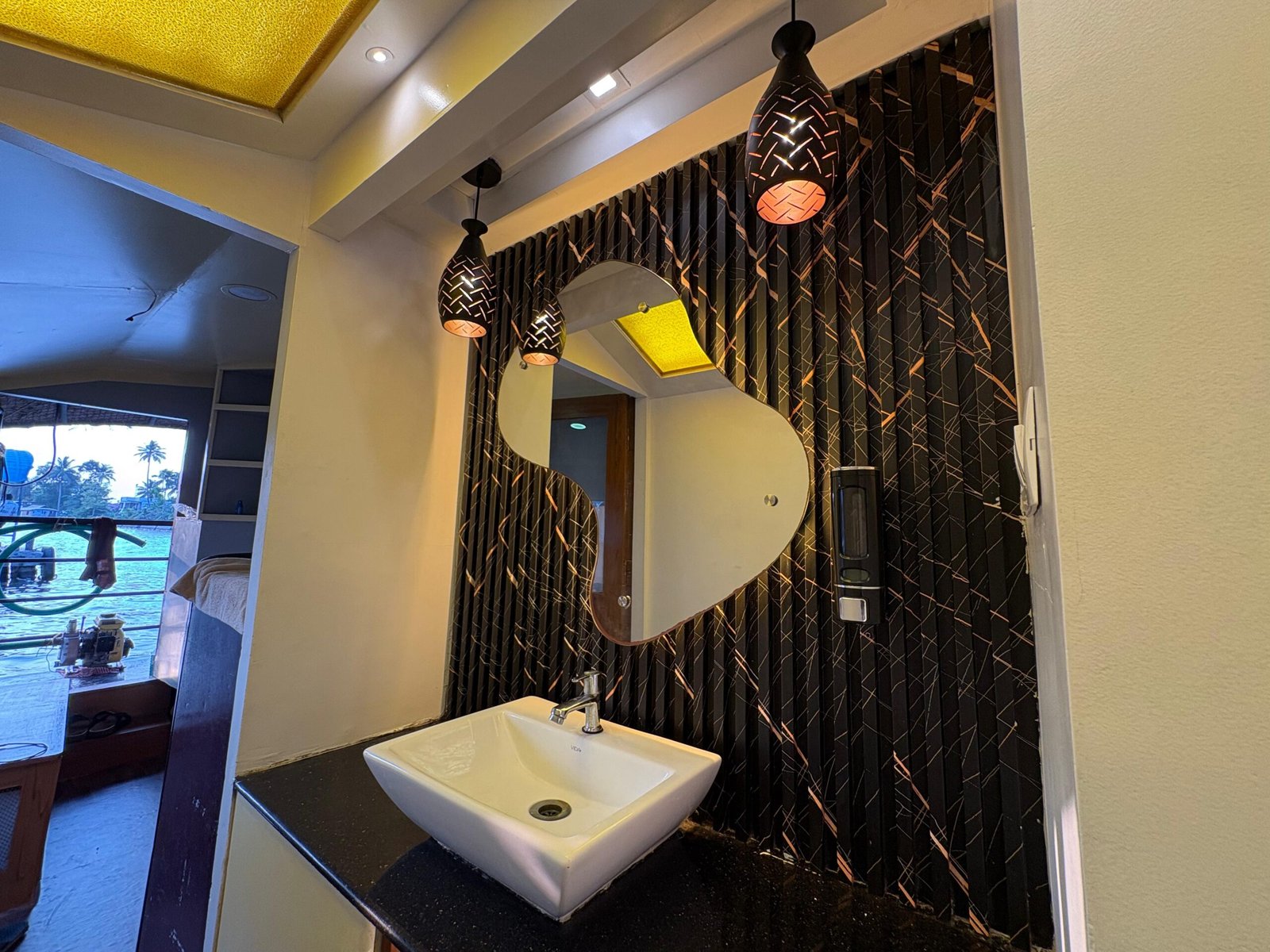 Modern washbasin and aesthetic mirror inside a premium houseboat bathroom