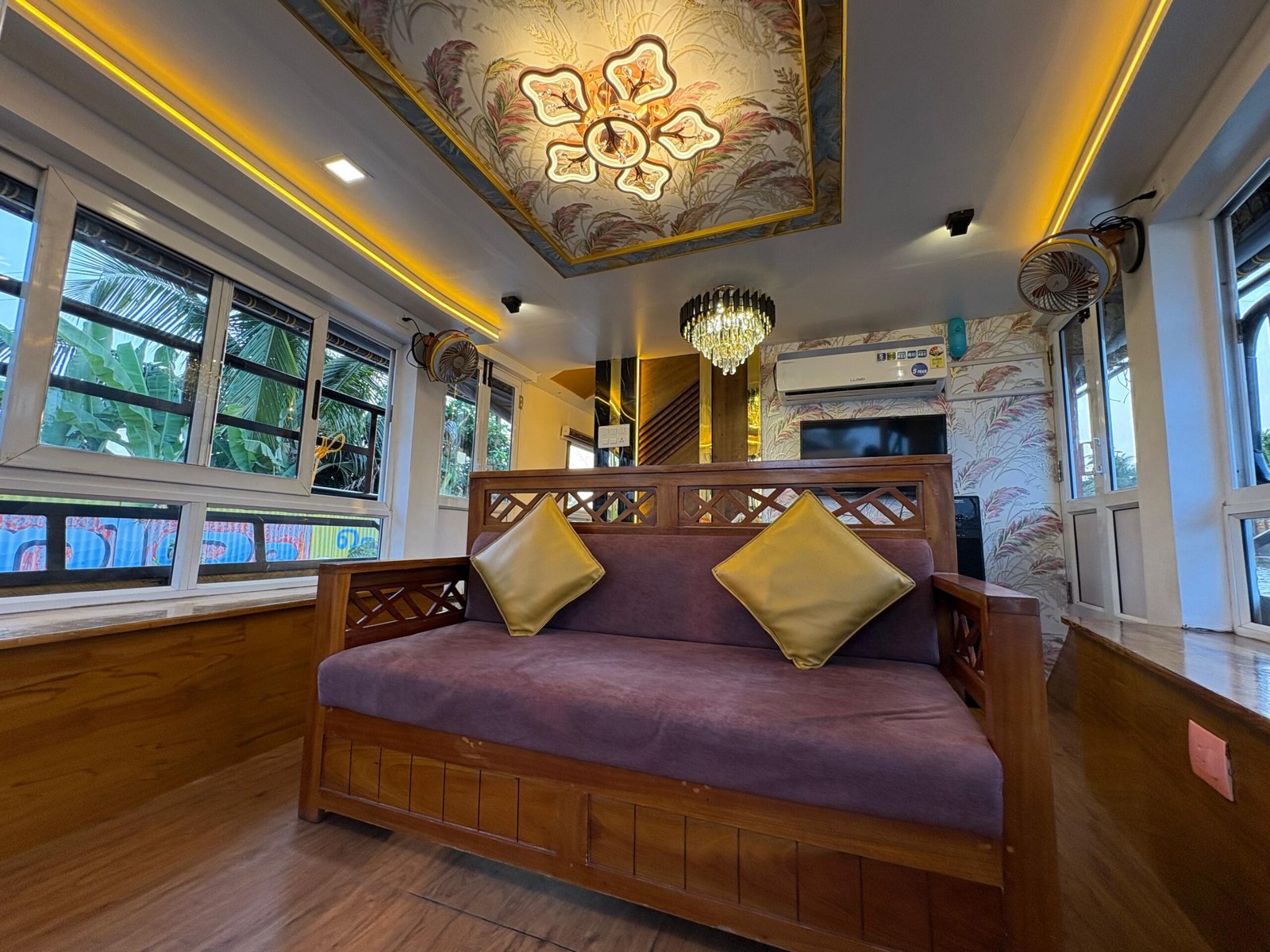 Premium dining space and lounge area inside a private Alleppey houseboat