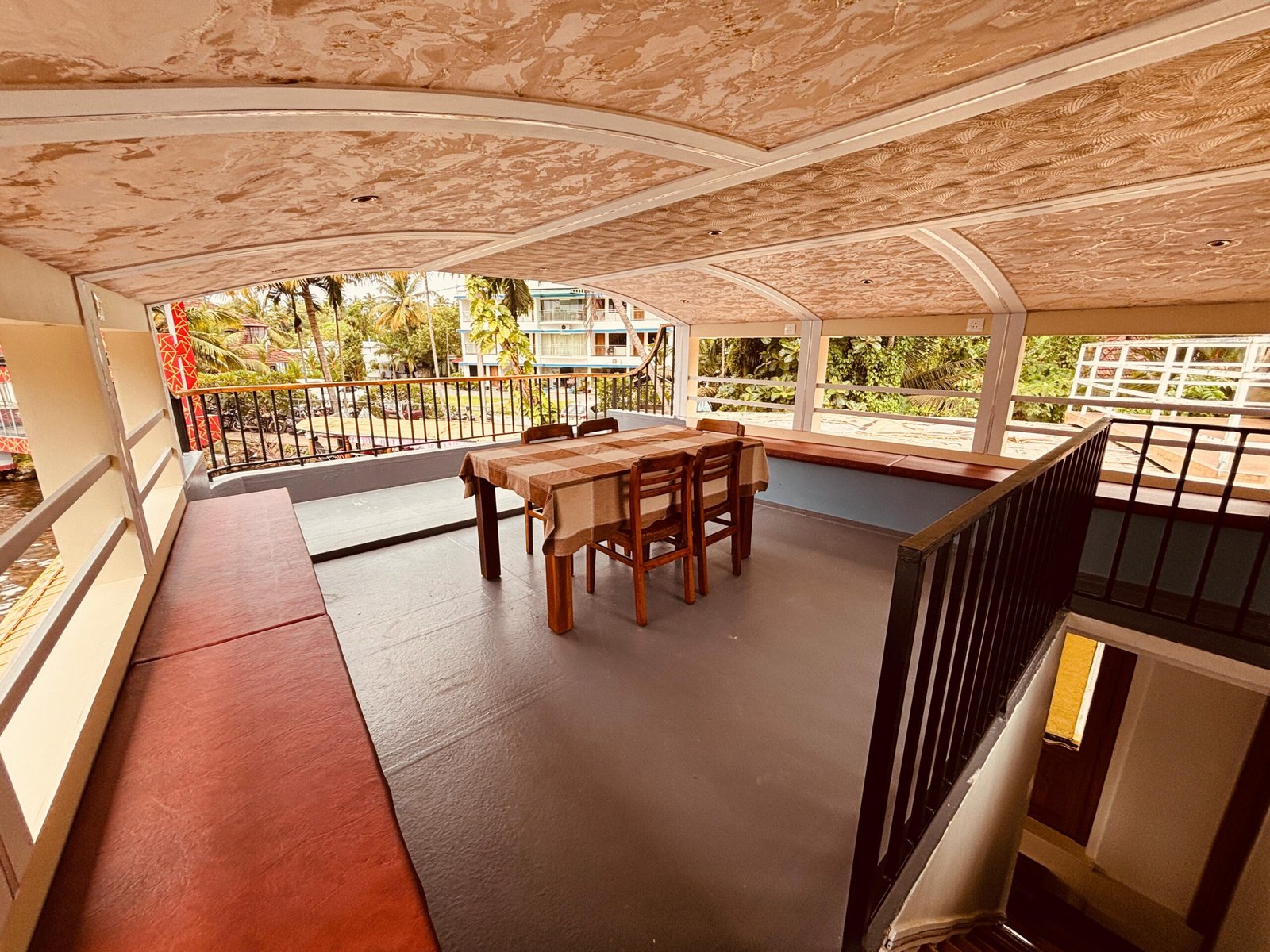 Upper Deck Dining Area Spacious open-air upper deck dining area offering panoramic views on our private 2 bedroom houseboat in Alleppey.