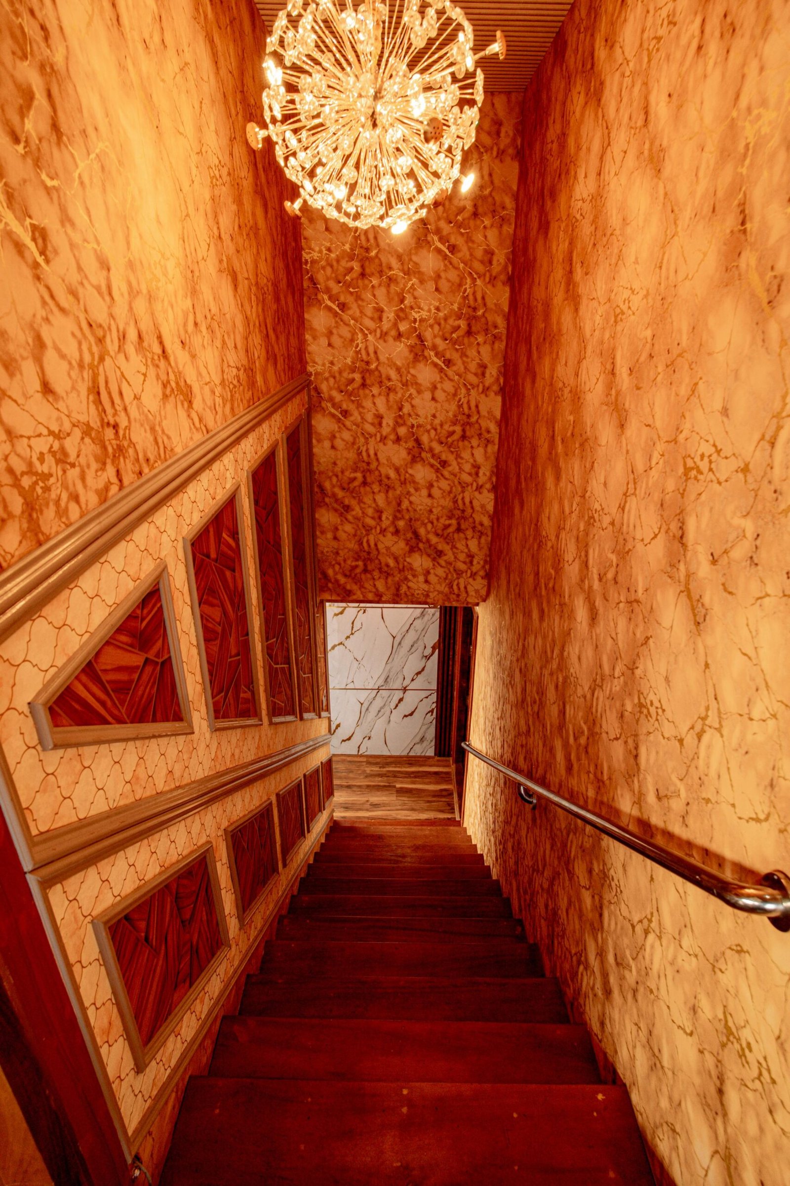 Beautifully crafted wooden staircase and hallway inside our Alleppey backwater boat
