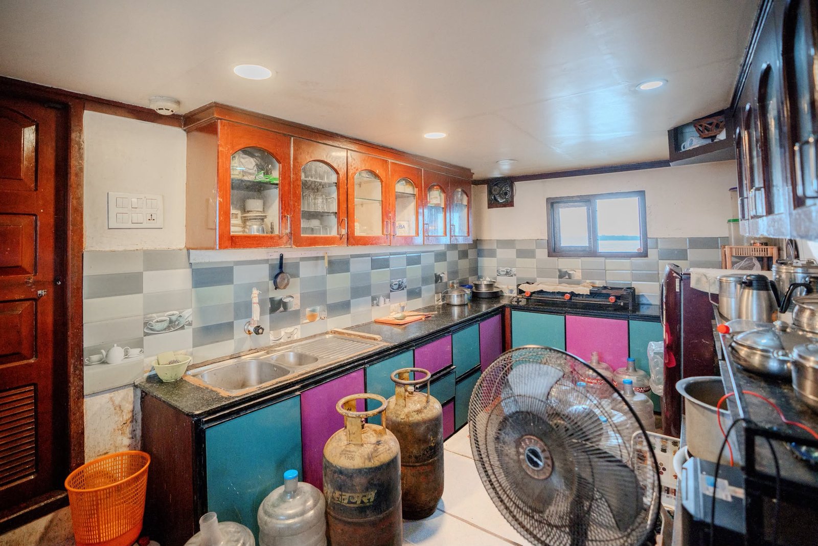 Onboard Kitchen - 6 Bedroom Houseboat Alleppey Fully equipped onboard kitchen managed by a private chef, preparing fresh meals on a 6 bedroom houseboat alleppey.