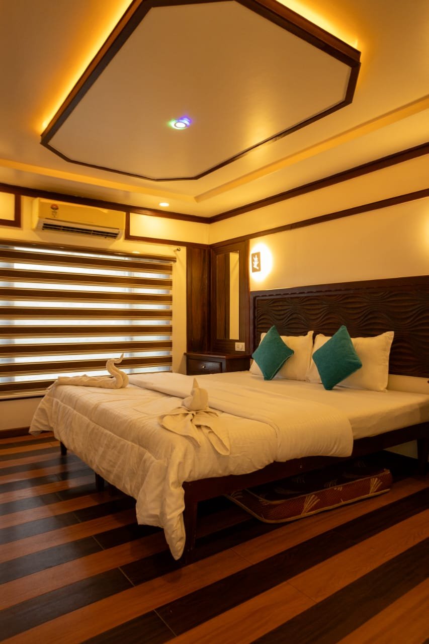 Upper Deck Balcony - 6 Bedroom Houseboat Alleppey Exclusive open-air upper deck balcony with artificial grass and backwater views on a 6 bedroom houseboat Alleppey.