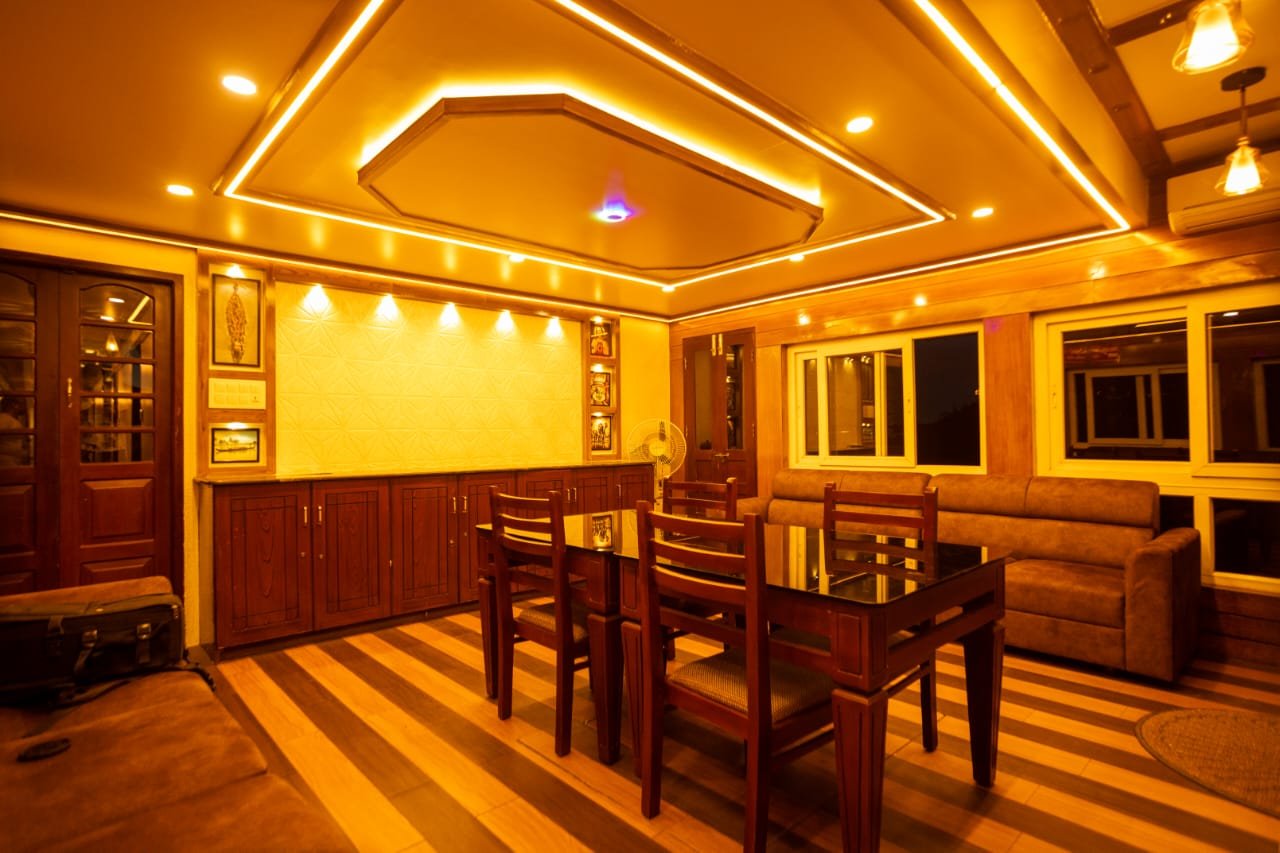 Large Indoor Dining Lounge Expansive indoor dining and lounge area perfect for a 6 bedroom houseboat Alleppey family trip