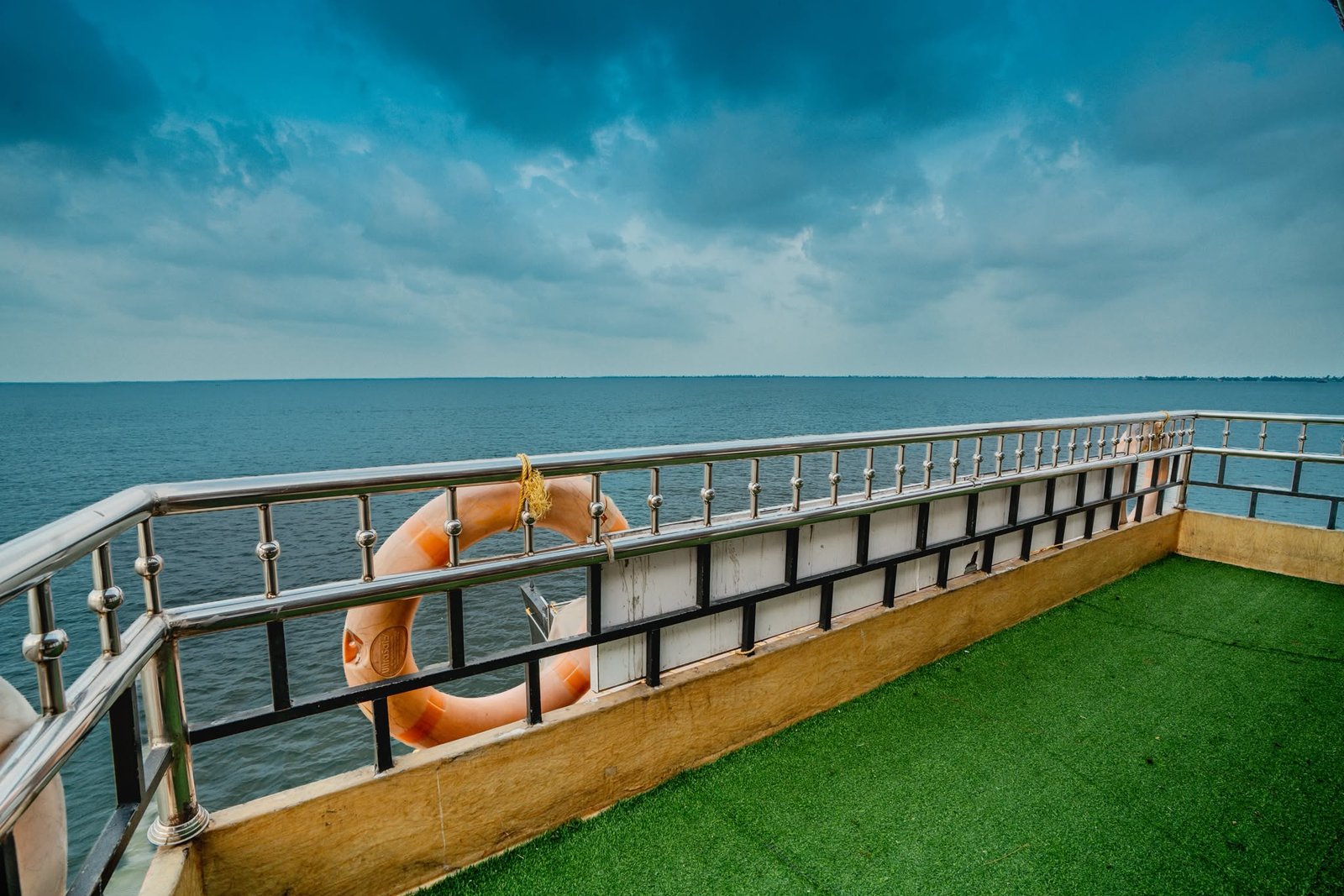 Open Air Upper Deck Balcony Open-air upper deck balcony with artificial grass flooring for sightseeing along the backwaters