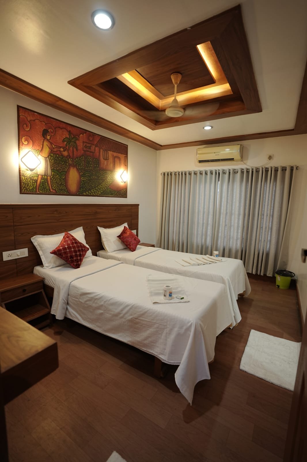 Twin bed AC room perfect for kids or friends joining a large group houseboat in Kerala.