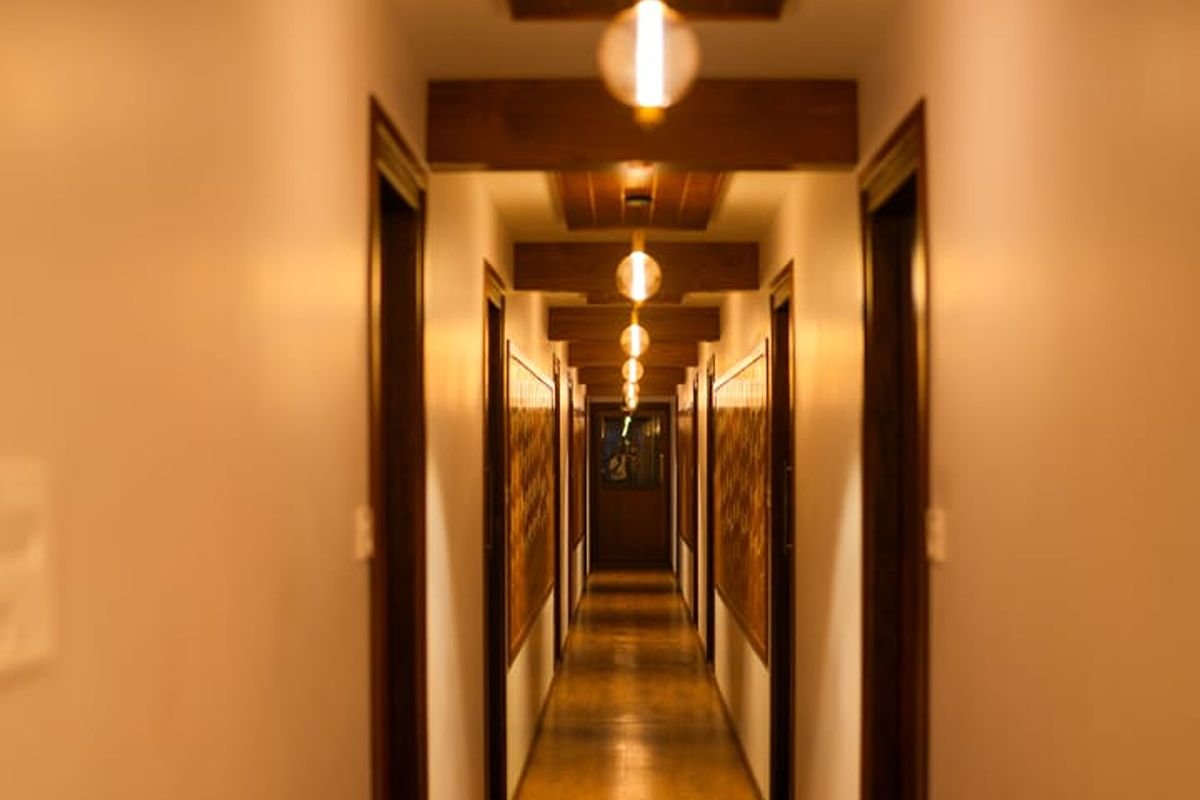 12 Bedroom Houseboat Alleppey Interior Hallway Illuminated interior hallway leading to guest rooms in the 12 bedroom houseboat Alleppey