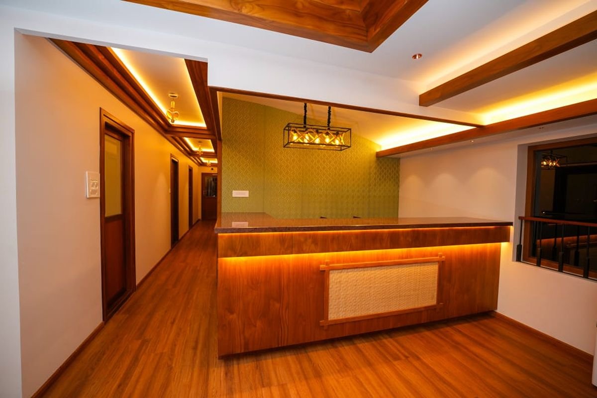 Wooden Counter Area in 12 Bedroom Houseboat Alleppey Elegant wooden reception counter area aboard the premium 12 bedroom houseboat Alleppey