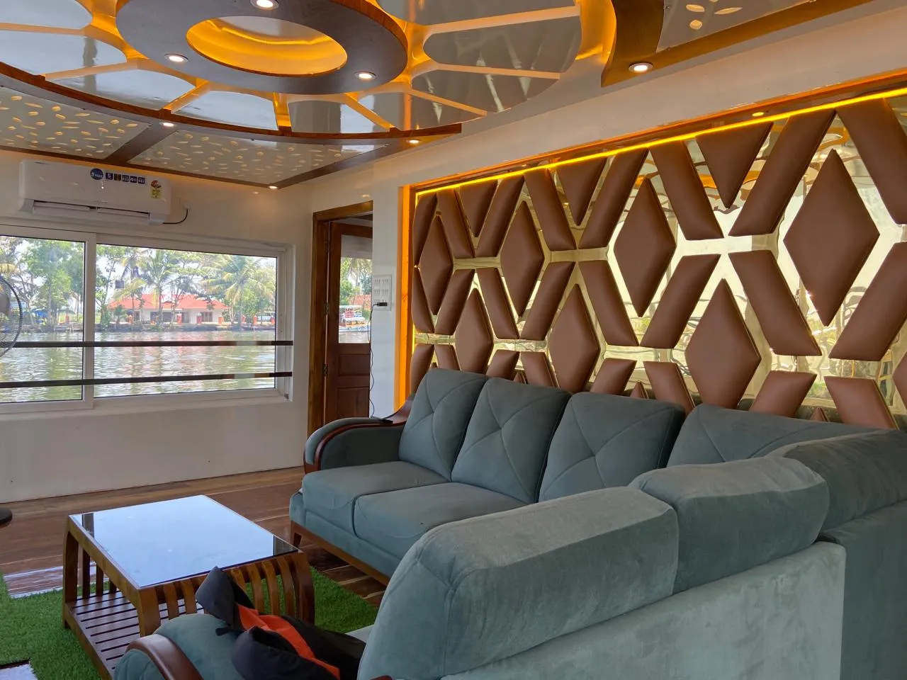 Spacious living area with modern sofa inside the 10 bedroom houseboat alleppey